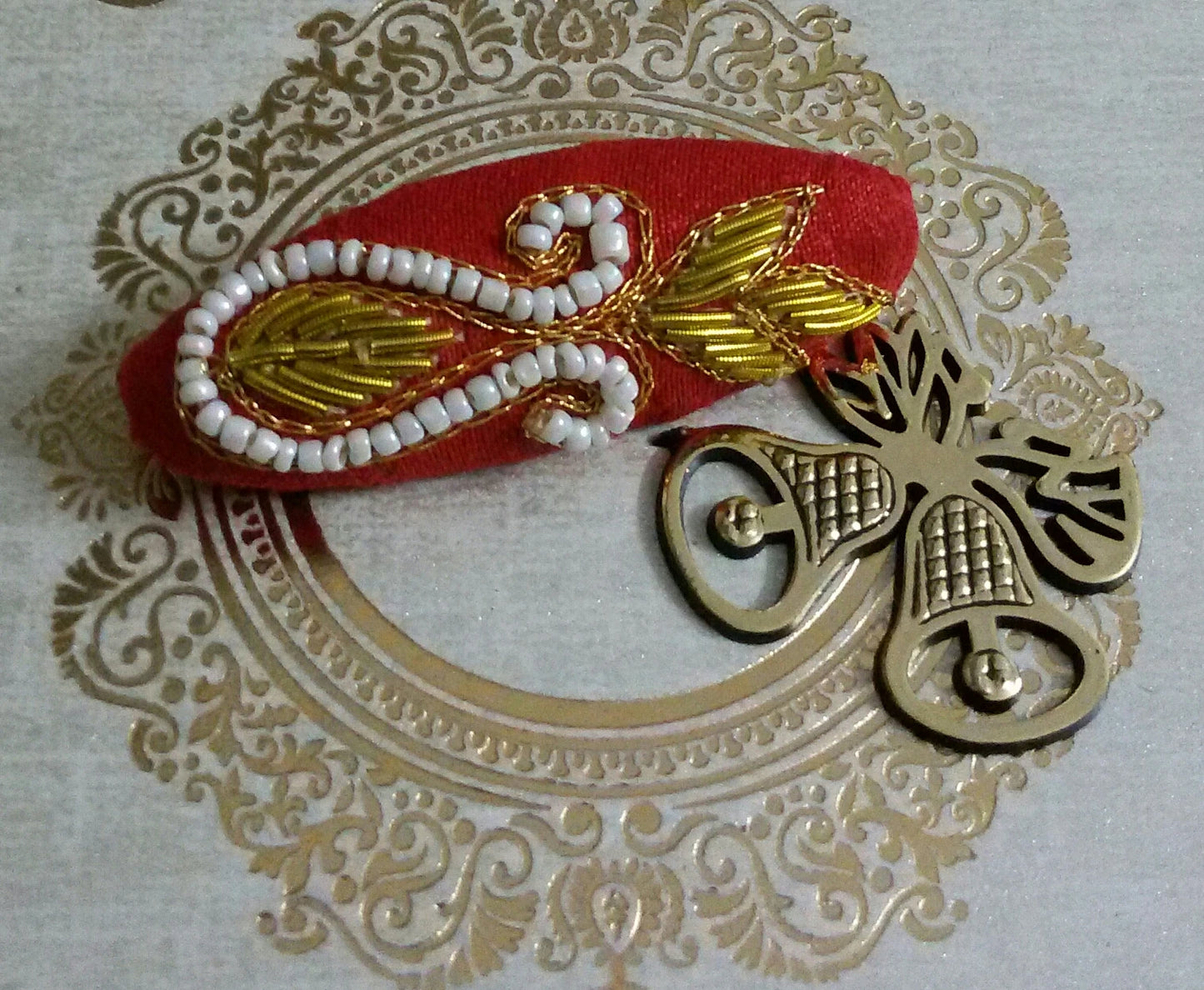 Red zardosi work saree pin