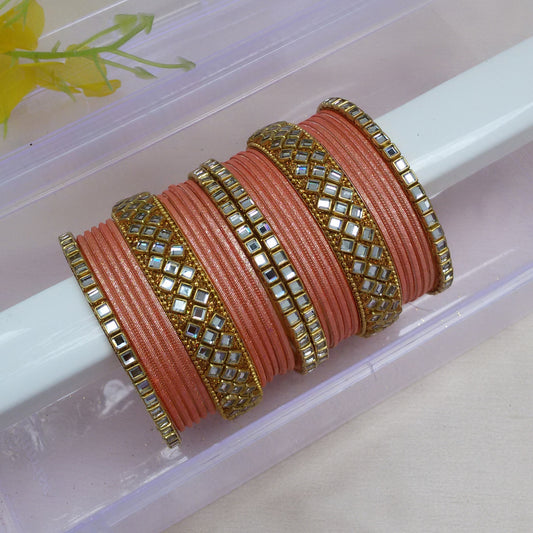 Peach metal kundan bangle set