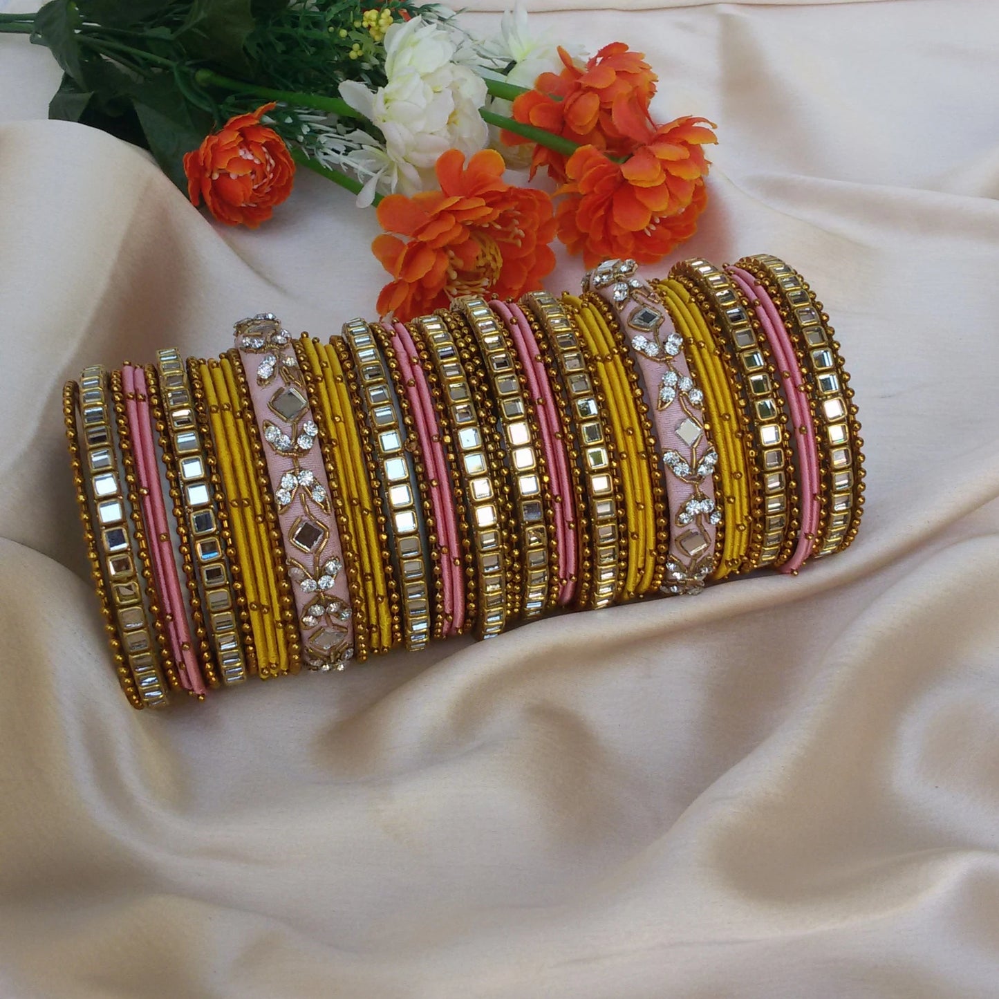 Yellow and pastel pink kundan bangle set