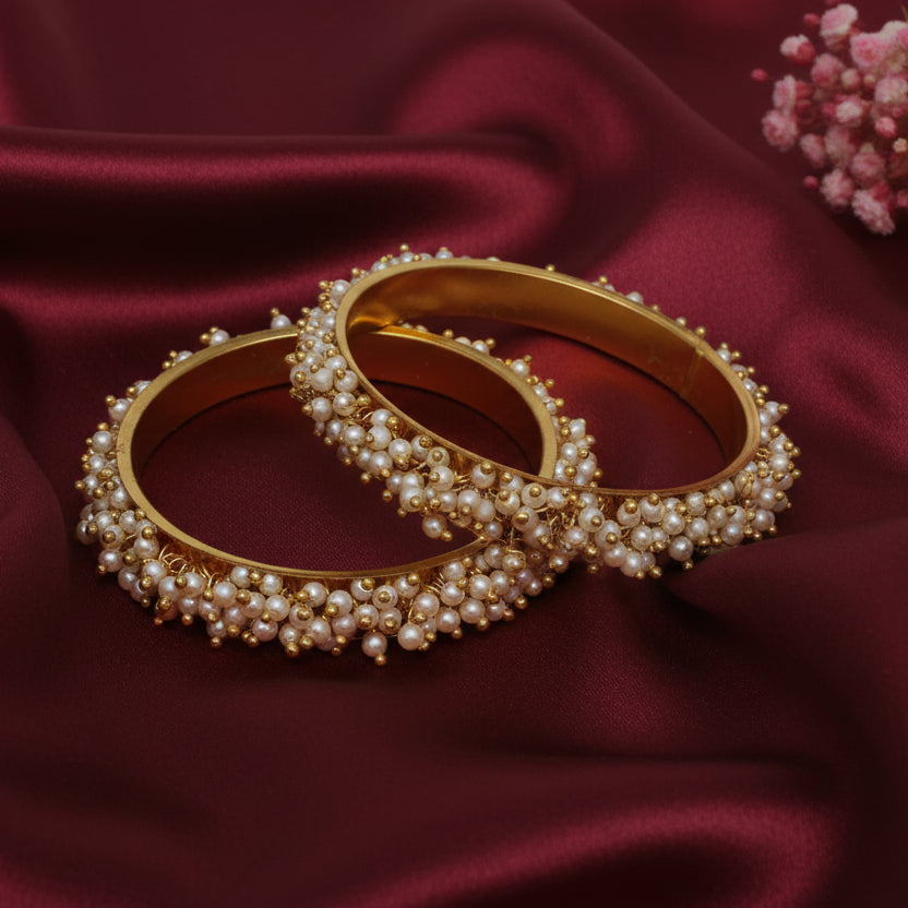 Gold plated Loreal pearl bangles